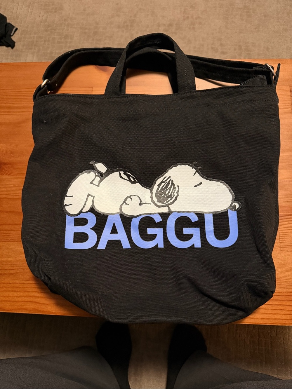 BAGGU Black Canvas Tote with Snoopy Sleeping Graphic and Blue Logo